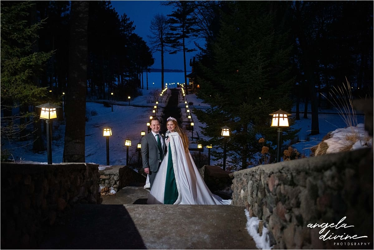 Minnesota bride and groom on lantern lit path