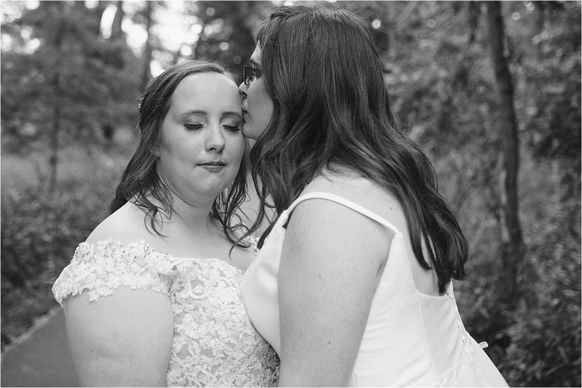 Westwood nature center LGBTQ wedding black and white photo of brides.